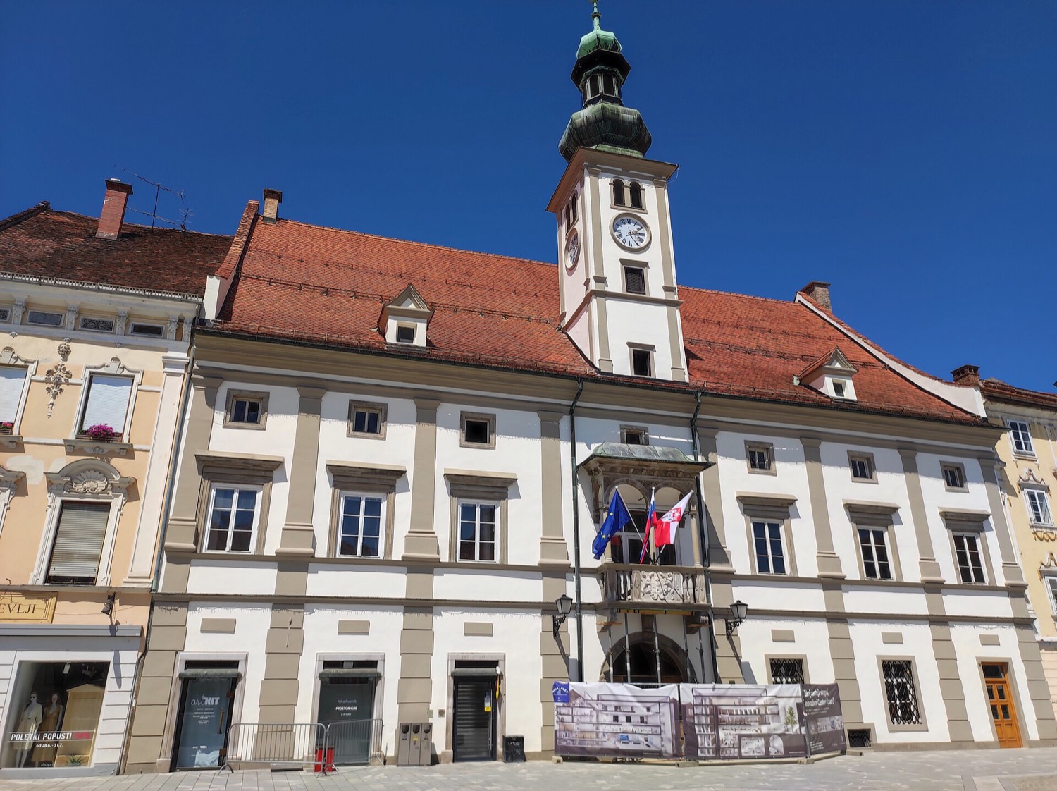The baroque town hall, Rotovž, on Glavni trg, Maribor's main square, under a clear sky
